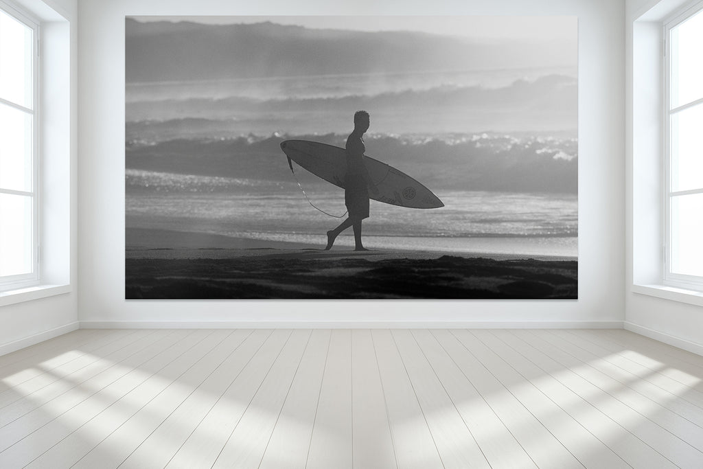 Surfing wall murals from Hawaii of a surfer walking on the beach on the North Shore of Oahu.