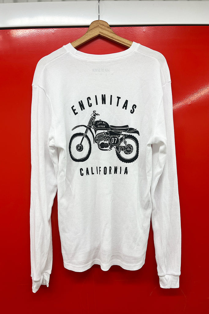 long sleeve white thermal with a graphic in black of a motocross dirt bike and words sea of seven california