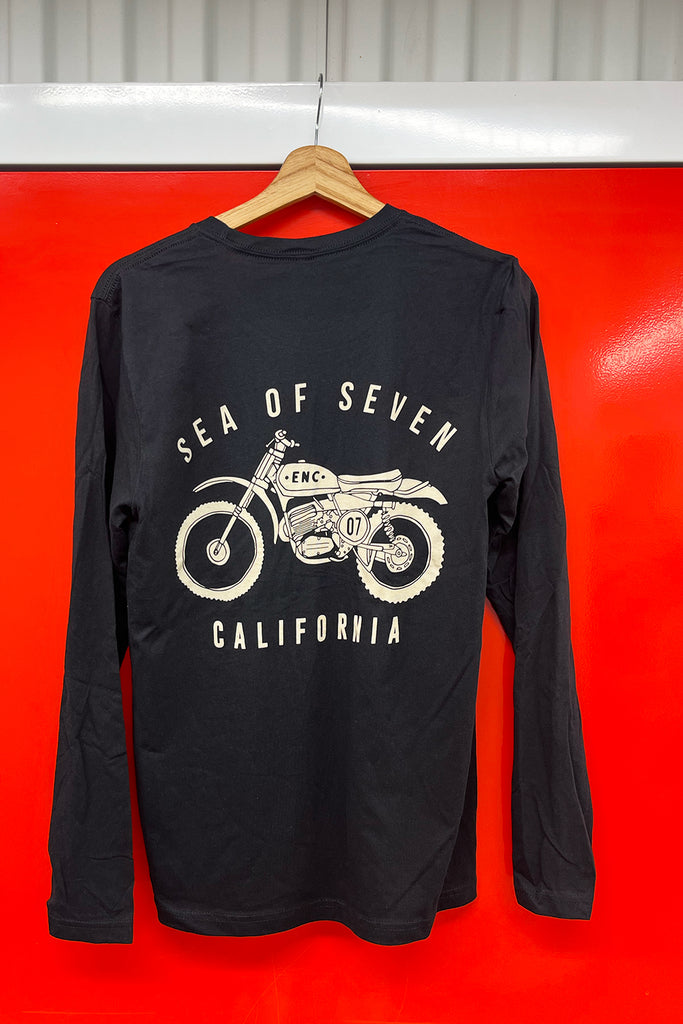 Black long-sleeve shirt with a motorcycle graphic and text 'SEA OF SEVEN and CALIFORNIA' on a red background