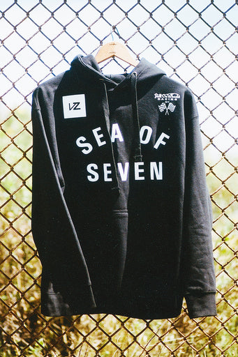 black pullover hoodie on a hanger with a vz graphic and the words sea of seven and hell on wheels racing.